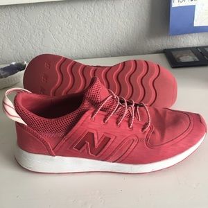Red New Balance slip on sneakers